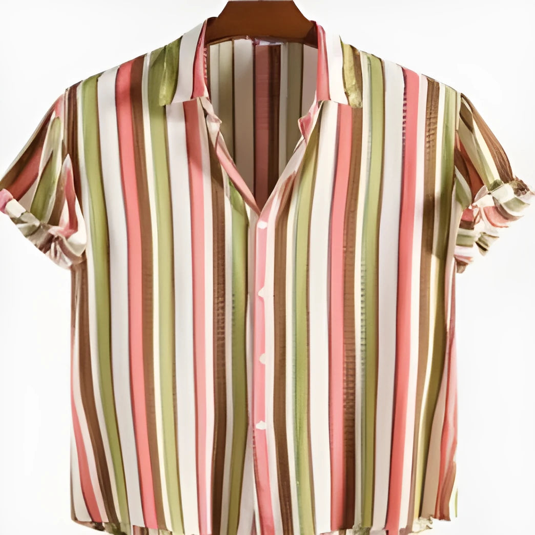 Man wearing a digital printed short sleeved polyester shirt in a summer setting.