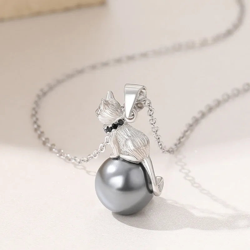 925 sterling silver cat pendant necklace on a clavicle-length chain, showing the detailed feline charm.