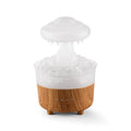 Wood grain finished rain cloud humidifier diffuser with coloured LED night light on table
