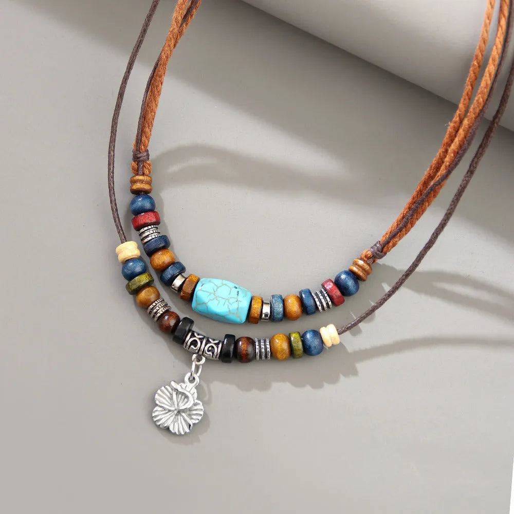 Men's wooden bead necklace with turquoise wax rope and geometric flower alloy pendant