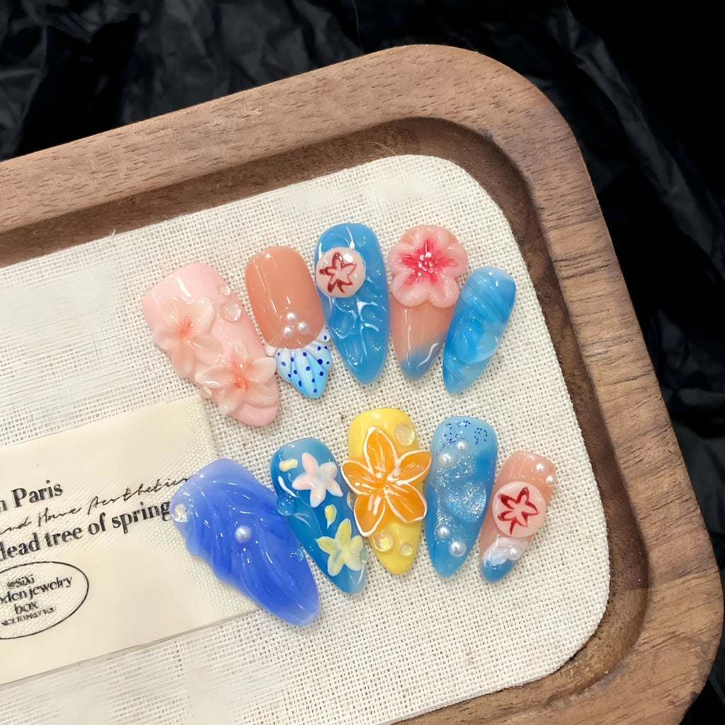 Plastic wearable armour with three-dimensional carved jellyfish design in almond nail colour