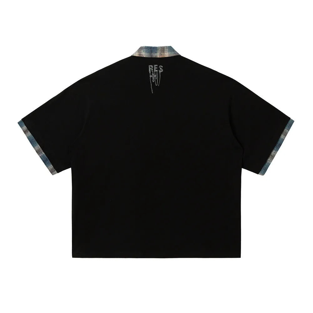 Men's loose blue cotton top with asymmetric cut and graffiti print on lapel.