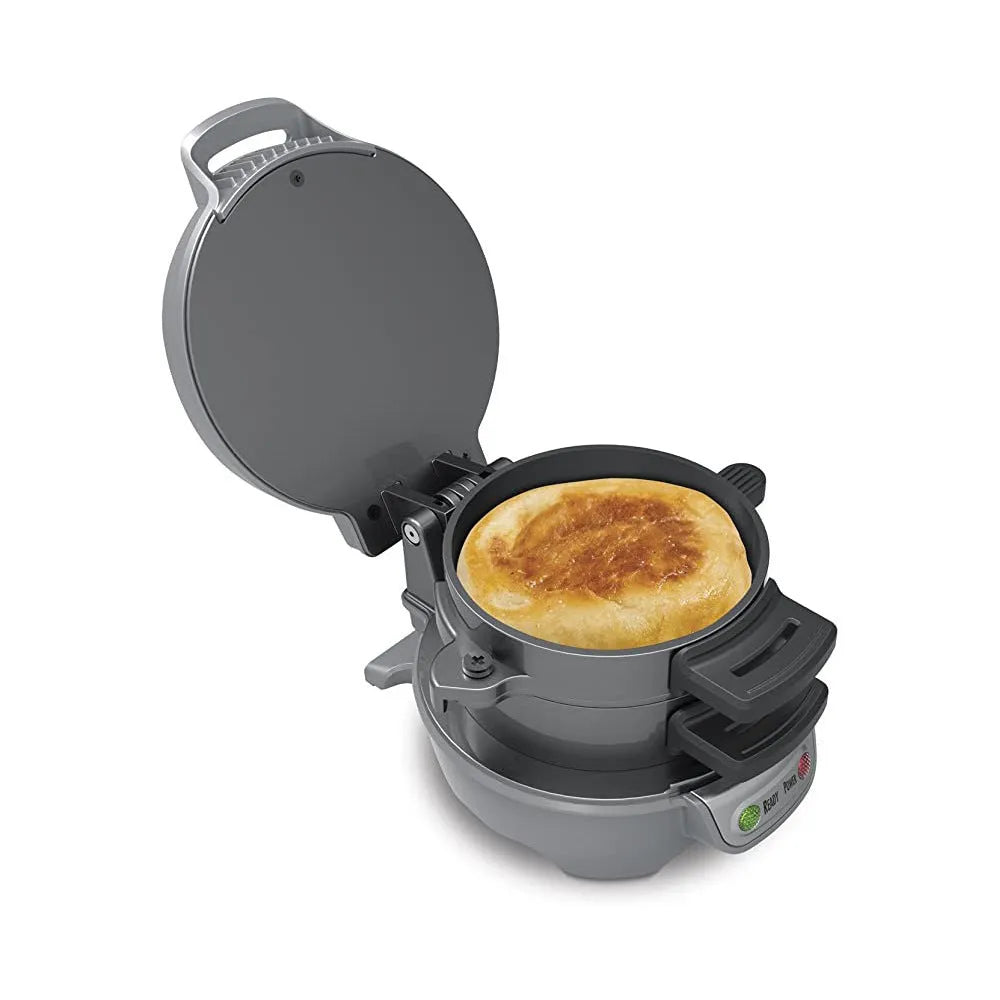 Bright red household breakfast machine with sandwich plates and egg cooker ring on countertop