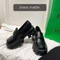 British style wide-fit loafers in patent leather with a muffin base heel and rubber sole.