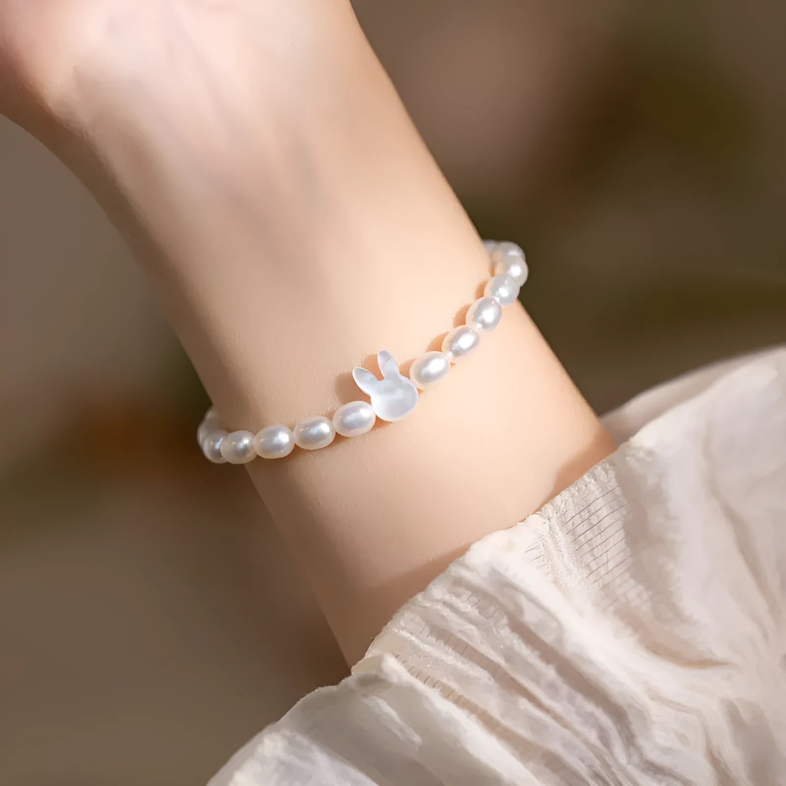 Handmade white shell pearl bracelet with 925 silver rabbit charm on 16cm elastic cord
