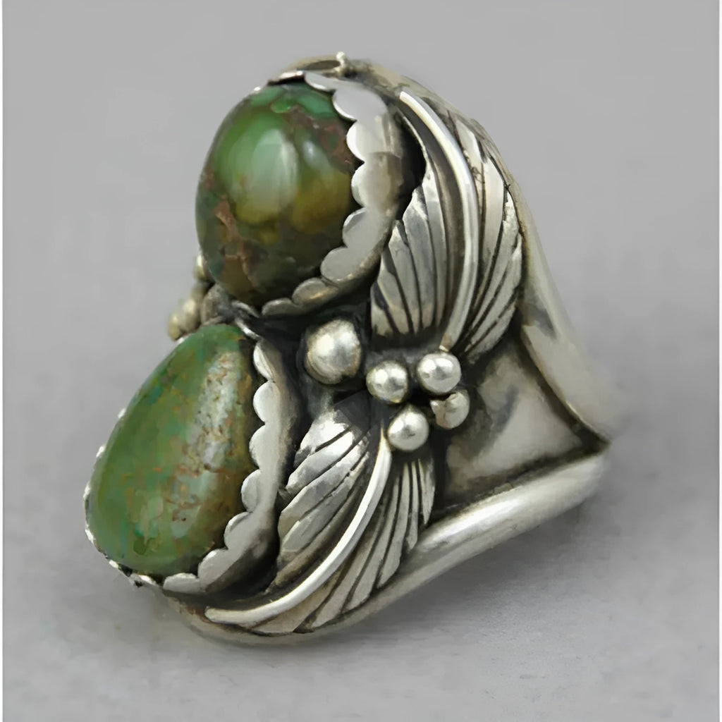 Women's geometric turquoise alloy ring with a retro inlaid design, shown on a finger.