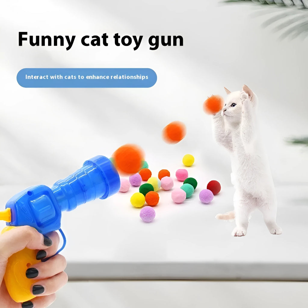 Pet toy launch gun with a selection of soft red plush balls for interactive dog and cat fetch games.