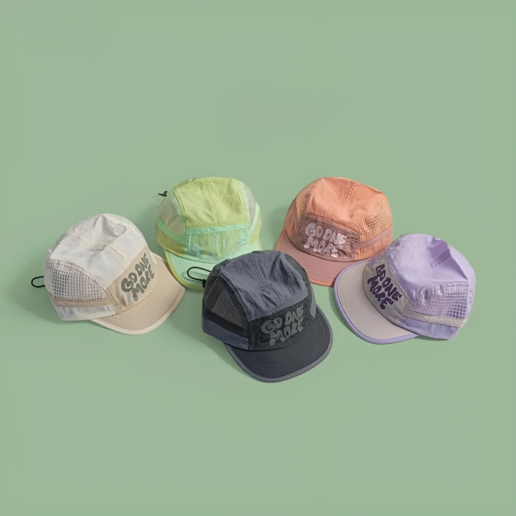 Gradient coloured quick-drying mesh baseball cap with dome crown and printed detail.