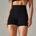 Dark green high waist women's fitness tights made from nylon spandex fabric.