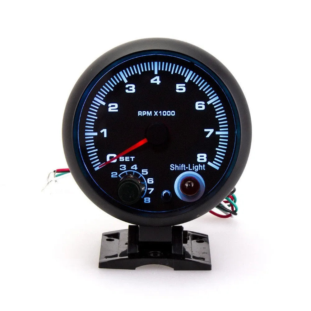 Black plastic automotive tachometer with blue light pointer display for engine speed measurement