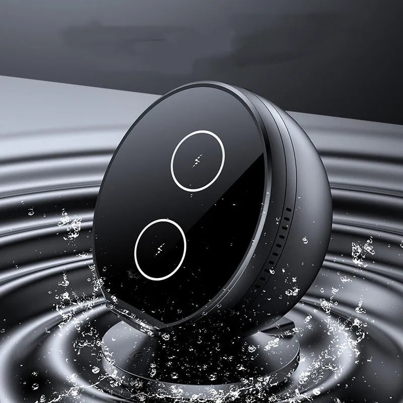 A black multifunctional wireless charging phone holder with integrated Bluetooth speaker on a desk.