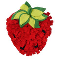 Red and green strawberry shaped pet slow feeder mat for dogs and cats on floor