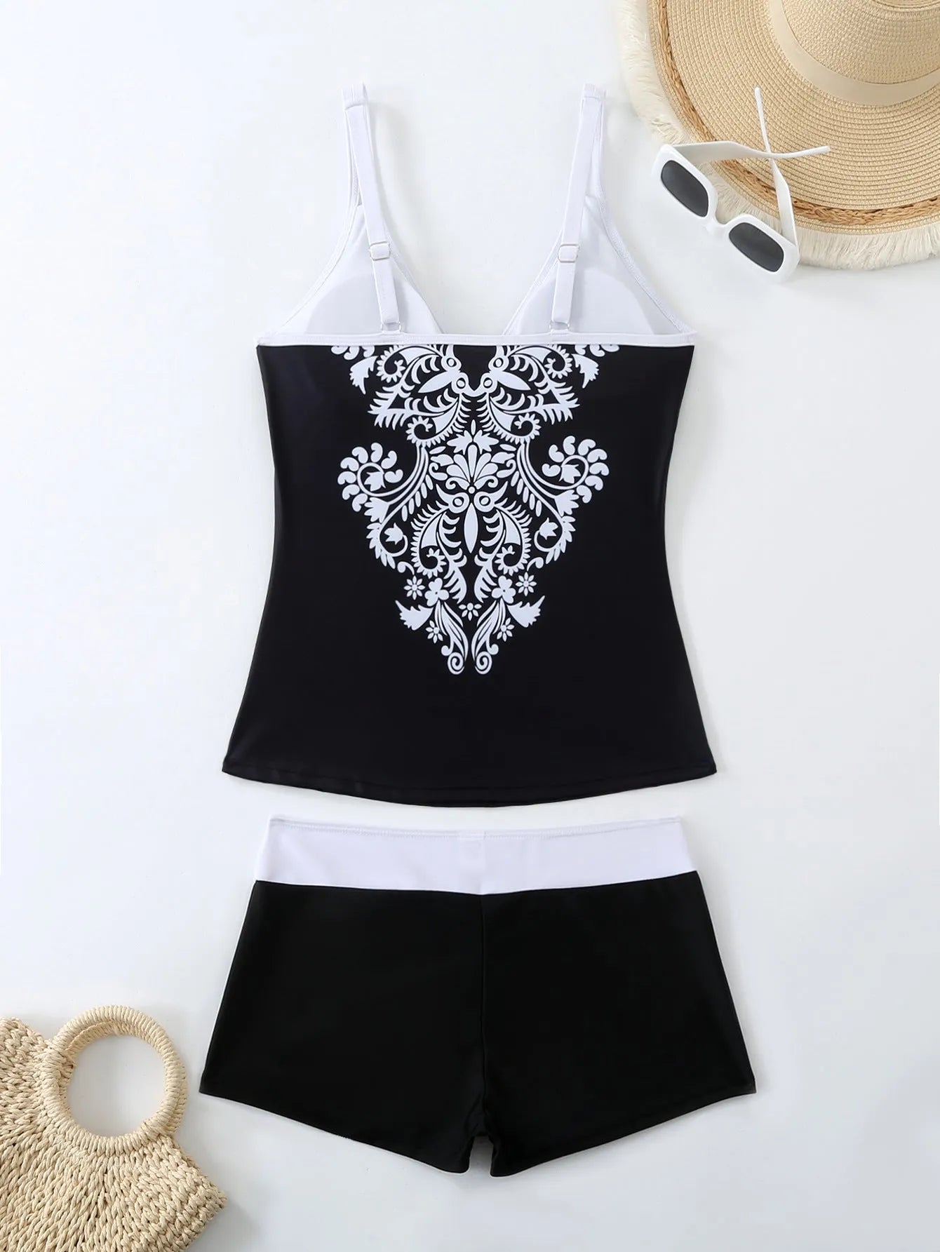 Plus size women's printed swim briefs in black or rose red with a cotton lining.