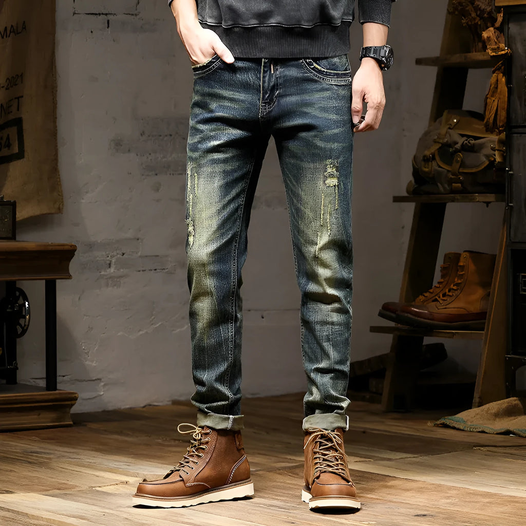 Men's retro blue jeans with stretch fabric in skinny fit style showing zip fly detail