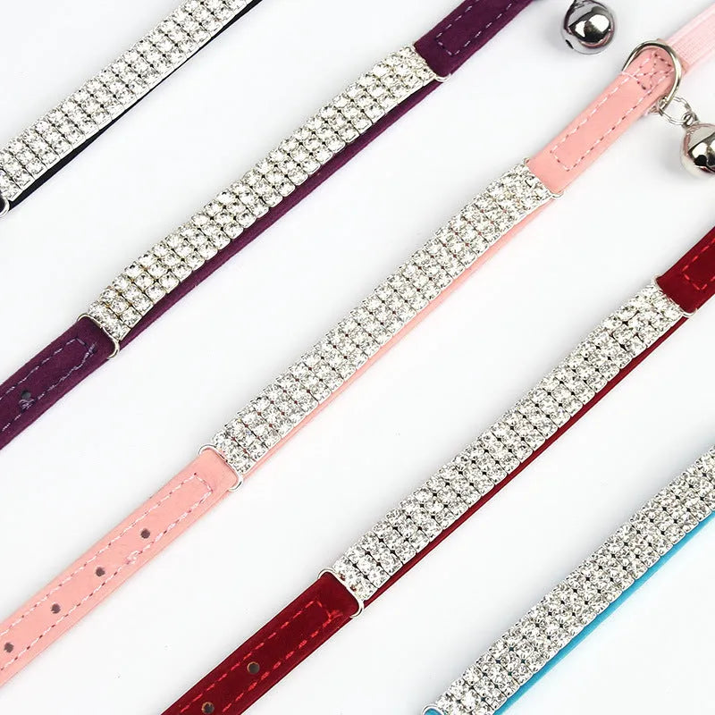 Adjustable velvet cat collar with rhinestones in red, blue, purple, black, and pink colour options.