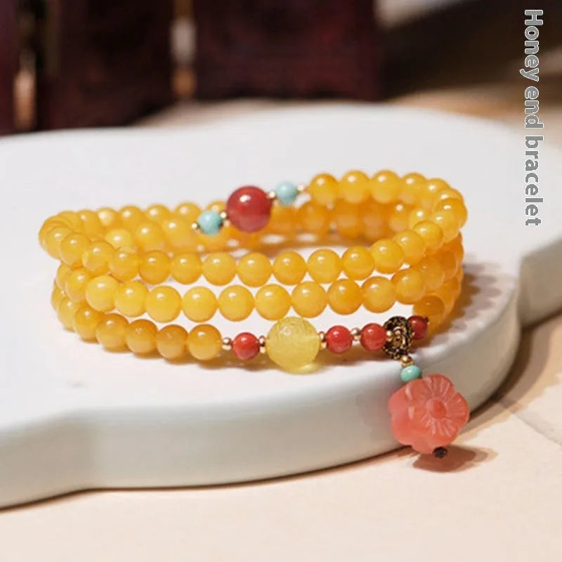 Yellow chicken grease beeswax amber bracelet with animal zodiac design in retro style
