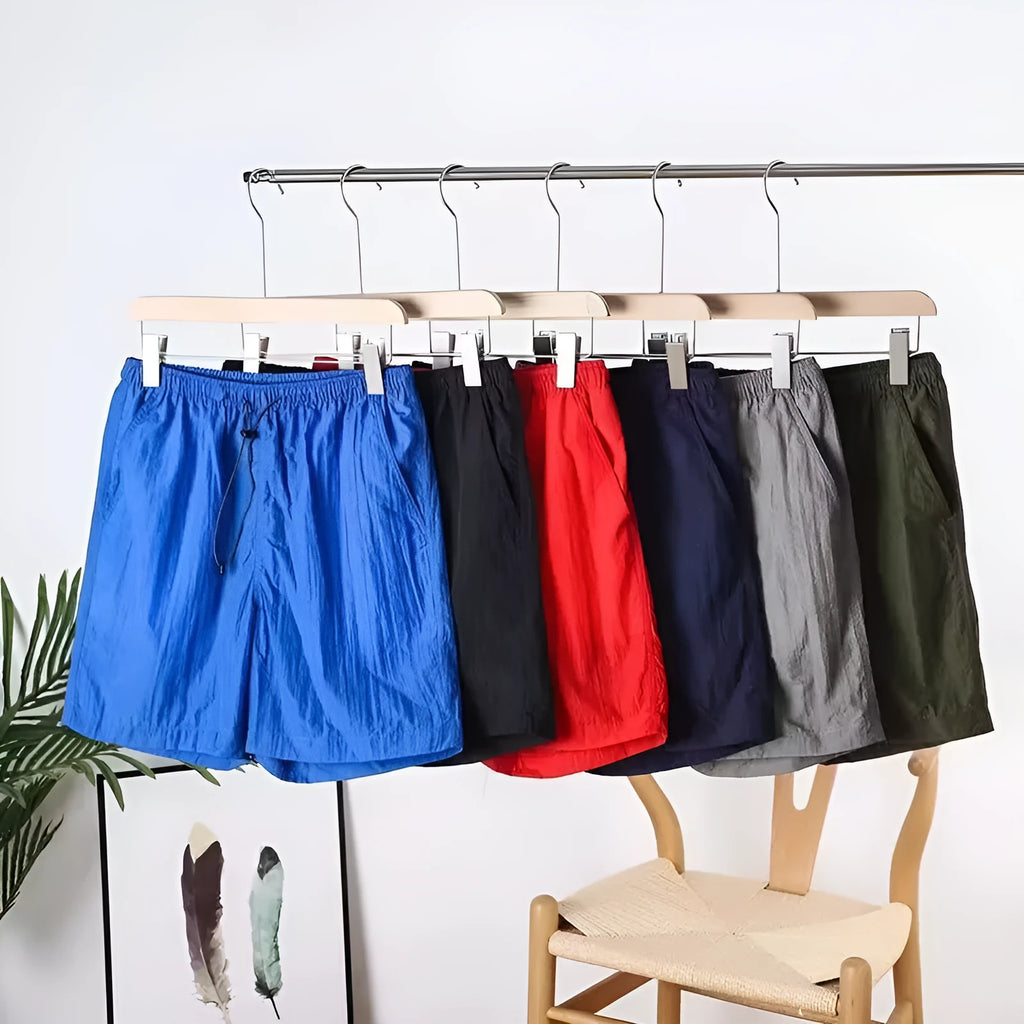 Men's straight-leg quick-dry sports shorts in army green on a plain background.