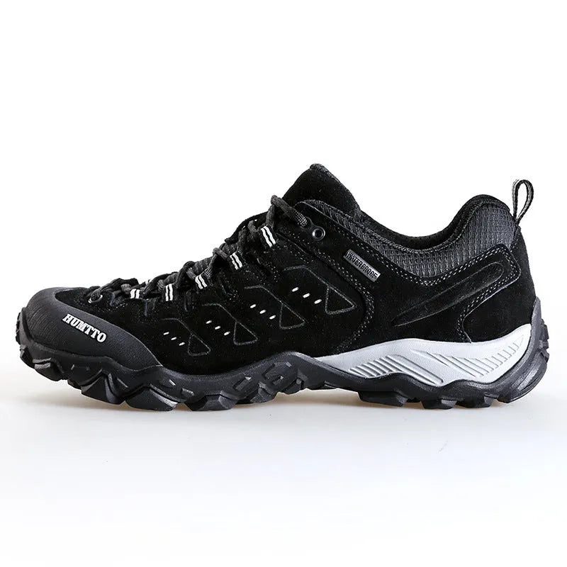 Men's black low top lightweight hiking shoes with EVA outsole and rubber sole on outdoor trail
