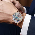 Men's zircon mechanical watch with stainless steel case and choice of strap on wrist.