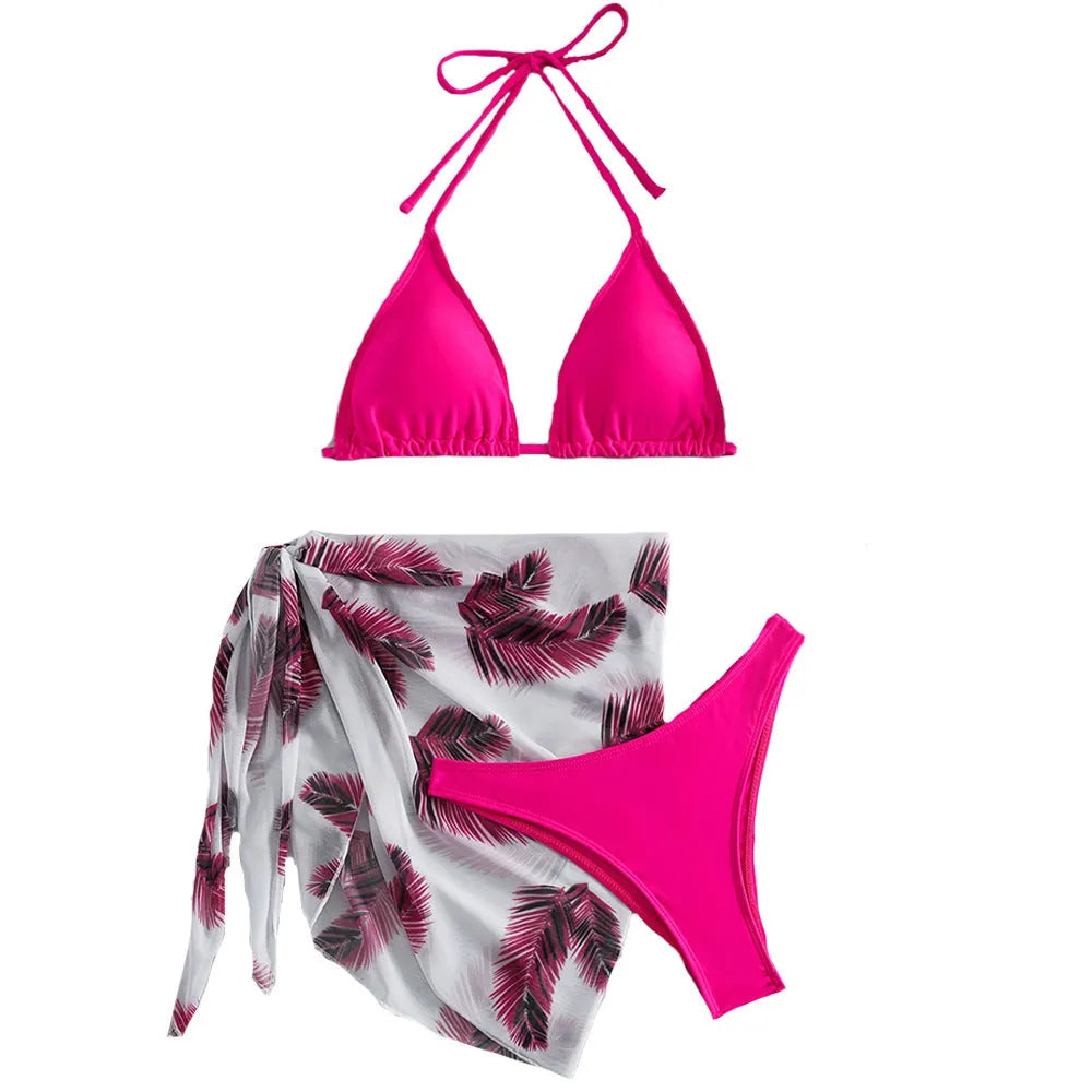 Women's orange three-piece bikini swimsuit set with a matching gauze skirt on a mannequin