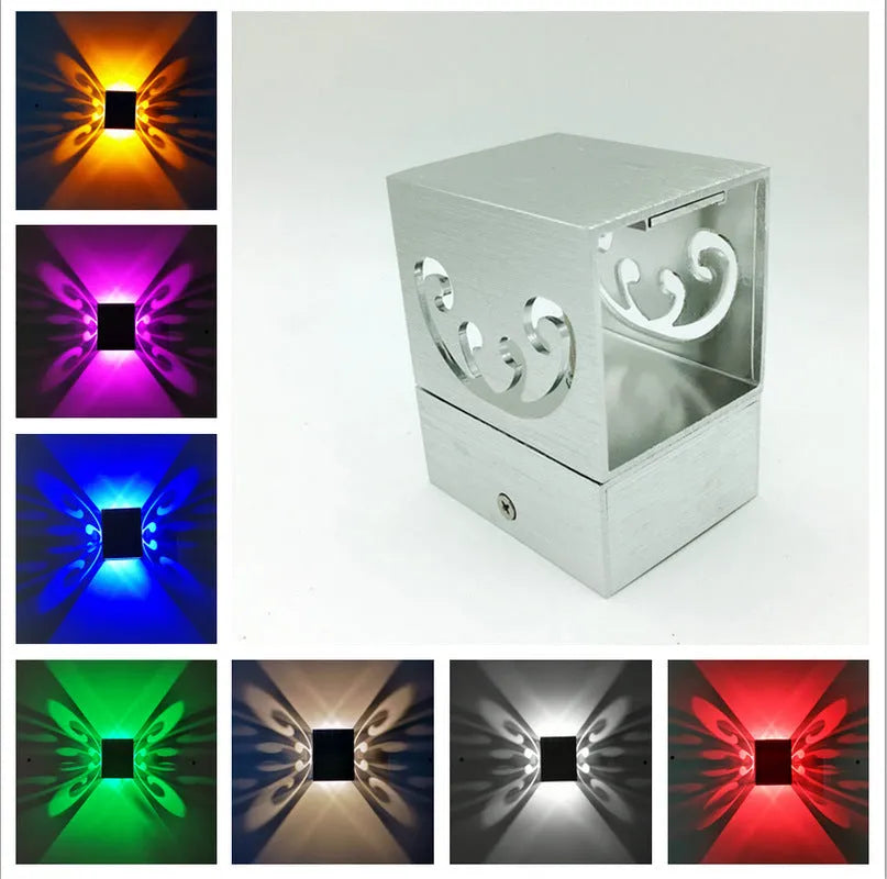 Modern aluminium LED butterfly wall lamp with remote control showing colour changing functionality