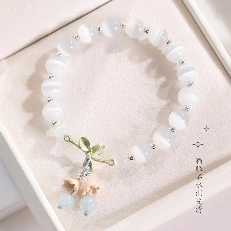 Women's cat's eye stone beaded bracelet with electroplated opal stones in diamond shape.