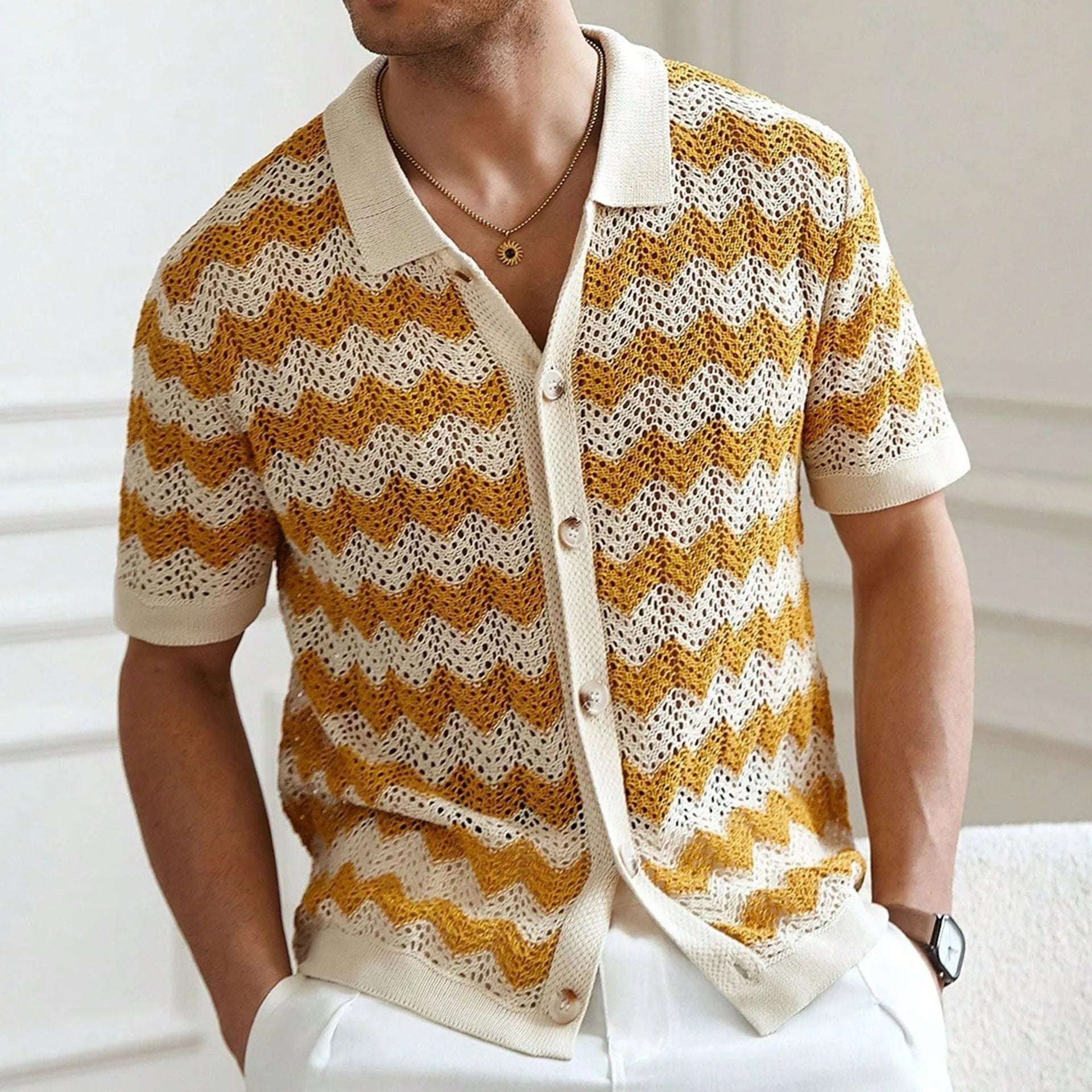 Yellow short sleeve sweater with a textured hollow jacquard corrugated pattern and flocking detail.