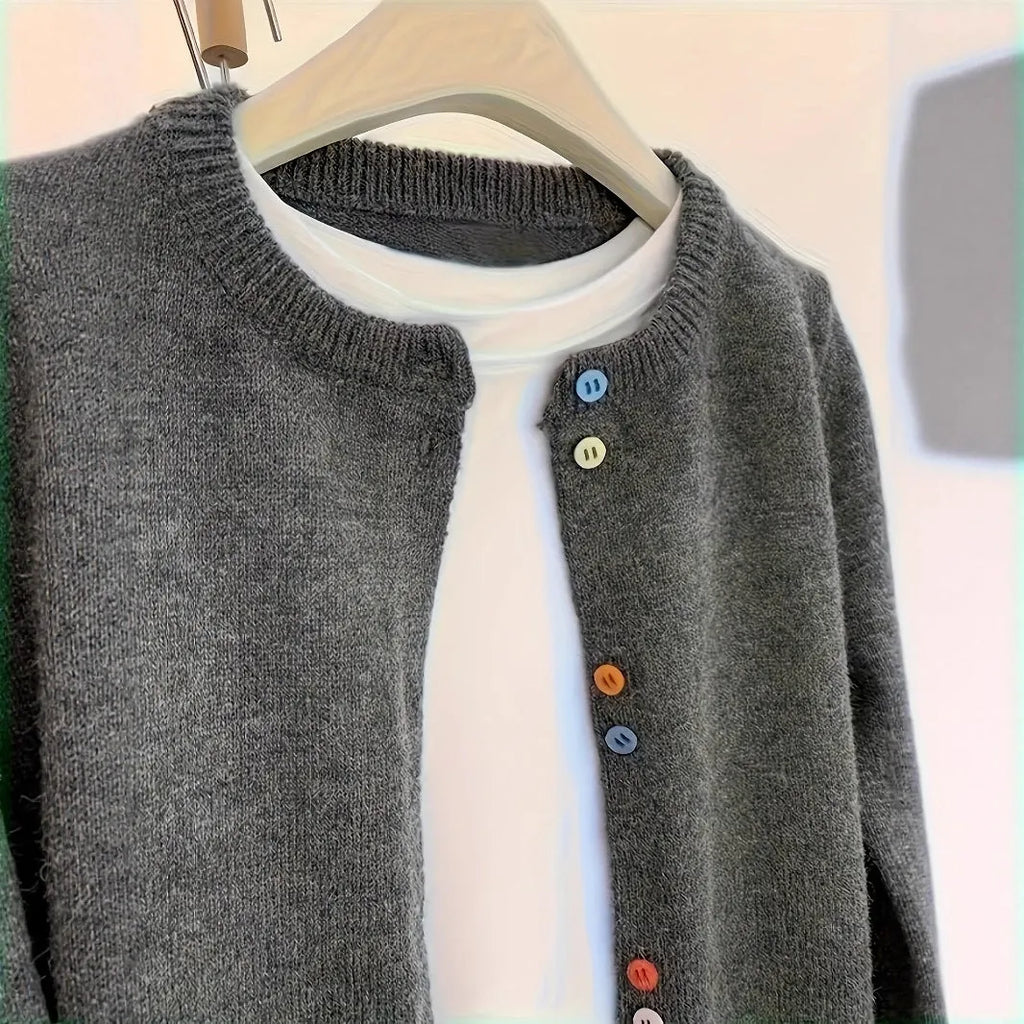 Dark grey women's button-front cardigan with long sleeves on a hanger.