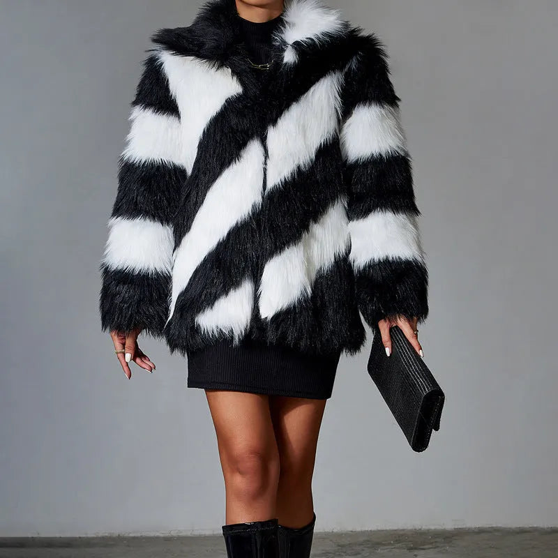 A minimalist faux fur coat with contrast lapels and a detachable fur collar, shown in picture colour.