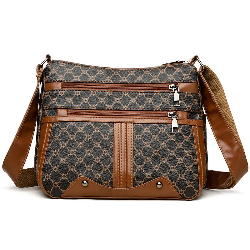 Brown stitching pattern women's crossbody bag made from PU leather with an adjustable strap.