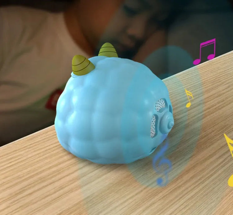Smart digital alarm clock with silicone casing featuring voice control and a motion sensor.
