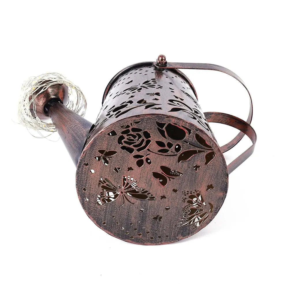 Solar-powered iron garden lantern with butterfly pattern and warm white LED light.