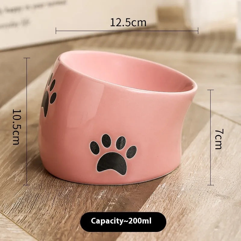 Ceramic cat bowl with high foot design and oblique mouth in cat's paw pattern