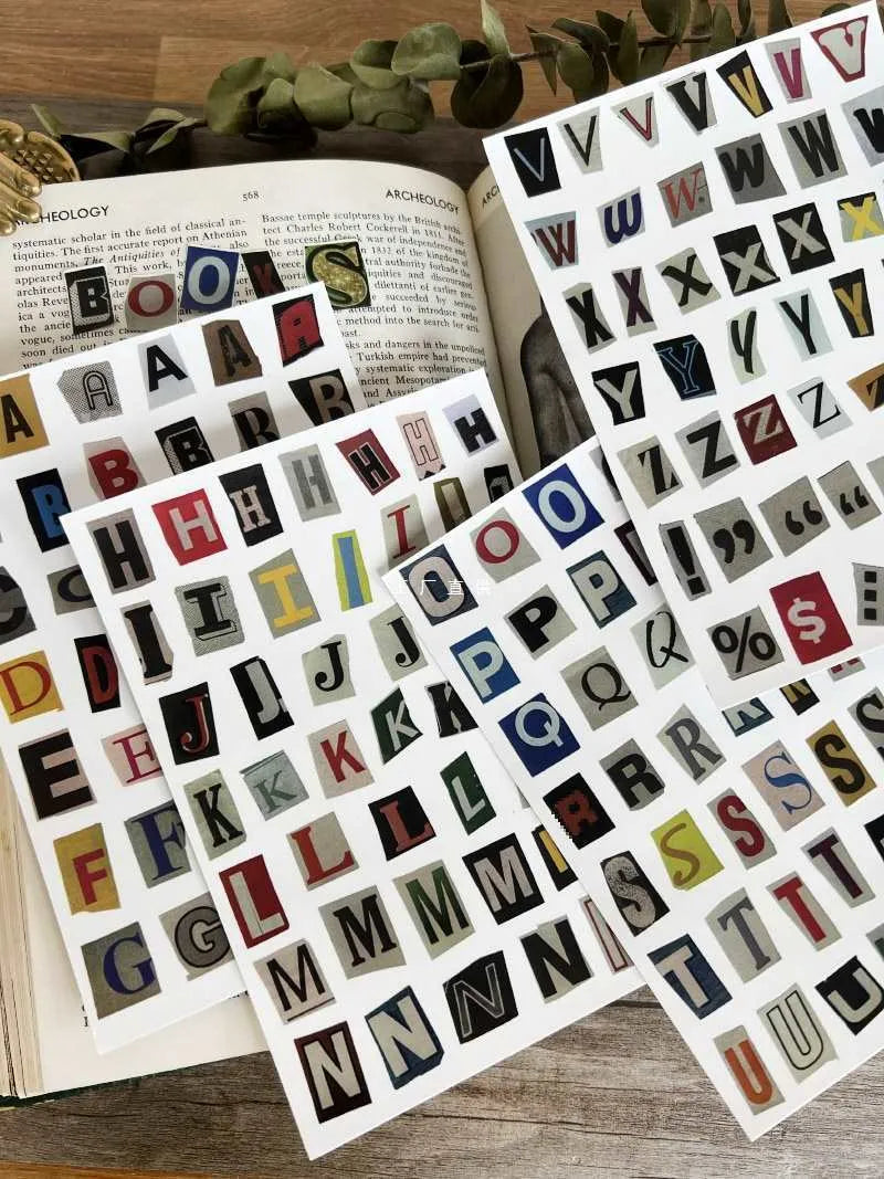 Set of cute style printed decoration stickers showing English letters, numbers, symbols, and weekly words.