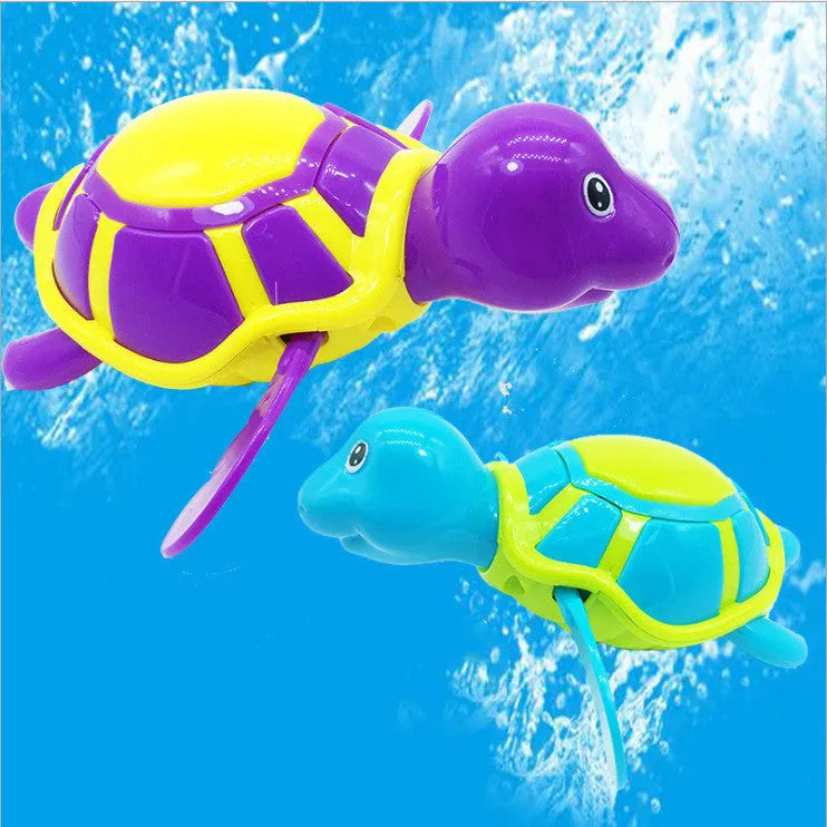 Plastic baby tortoise bath toy floating in water for bath time play