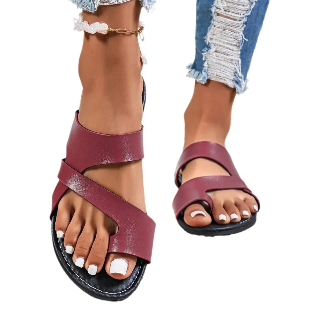 Casual round toe beach slippers with hollow-out pattern and rubber sole in black, brown, or wine red.