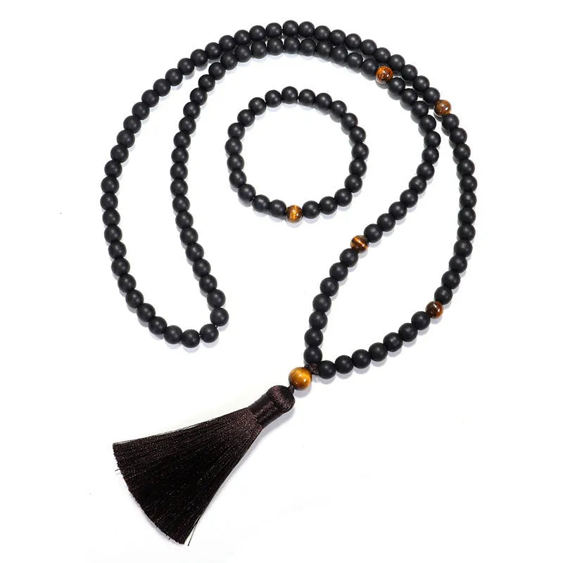 Tiger eye stone beaded necklace and bracelet set with tassel pendants on white background