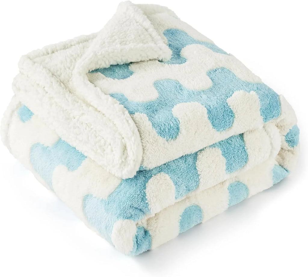 Waterproof dog blanket in blue sky white clouds pattern showing size options