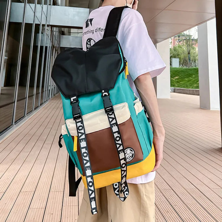 Oxford cloth student backpack in black, green, or red, showing handheld and shoulder straps.