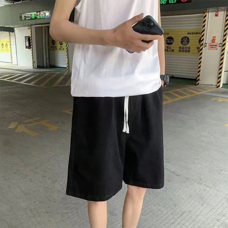 Men's loose straight casual cotton denim shorts in dark blue, front view