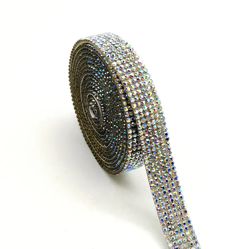 Self-adhesive water drill rhinestone strip in white and AB colour on a one-yard roll.
