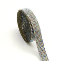 Self-adhesive water drill rhinestone strip in white and AB colour on a one-yard roll.