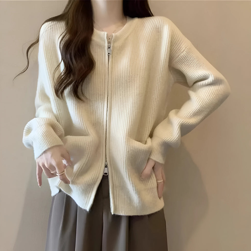 Beige viscose sweater coat cardigan with long sleeves on a hanger.