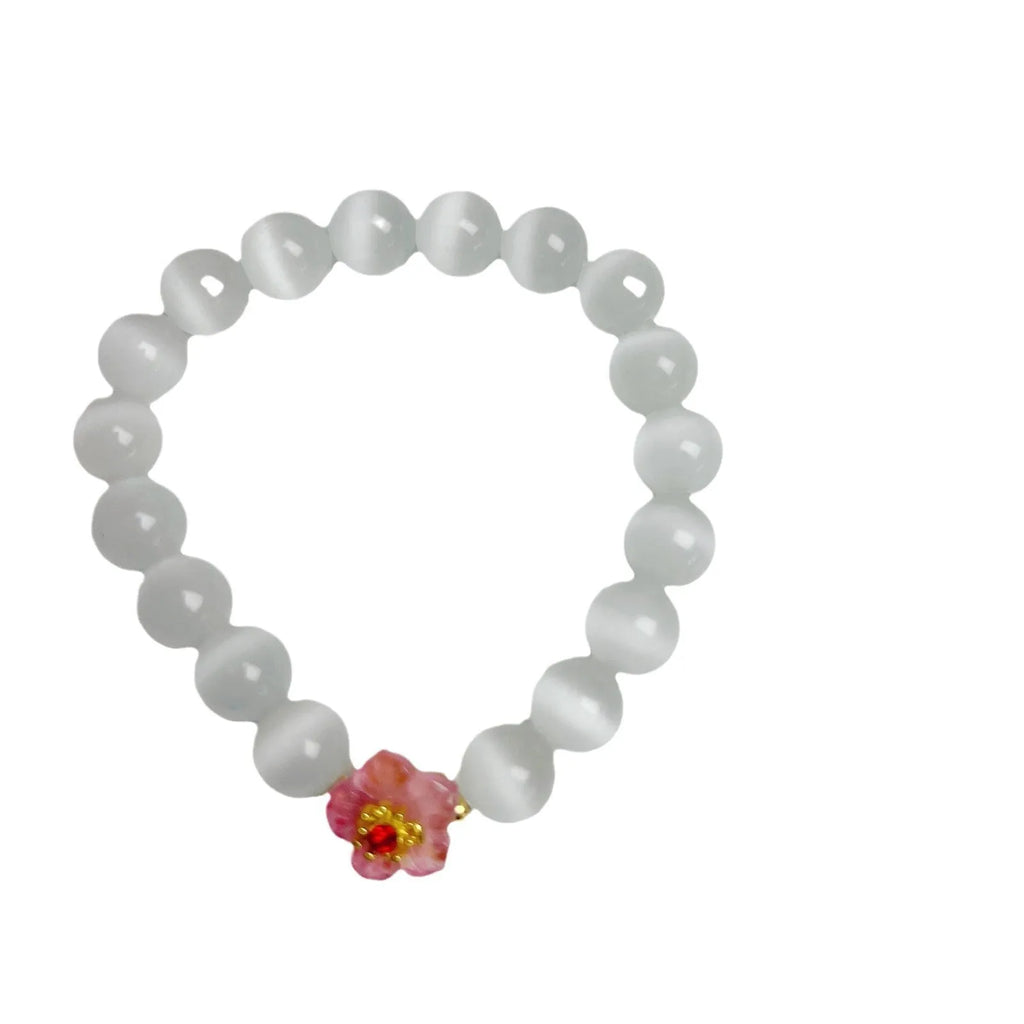 Handmade women's glass beaded bracelet with flower elements in multiple colour options