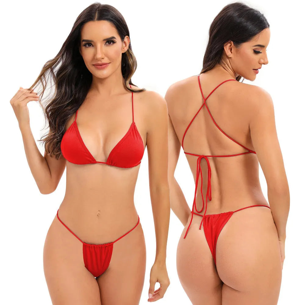 Women's candy coloured cross strap split swimsuit with adjustable multiple straps in striped spandex fabric.