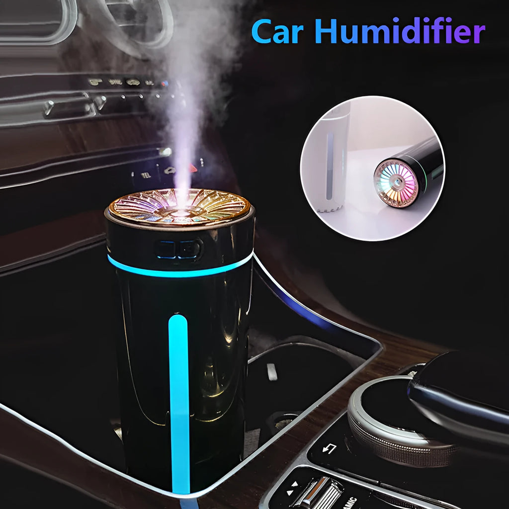 Black portable USB humidifier with colourful lights on a car cup holder.
