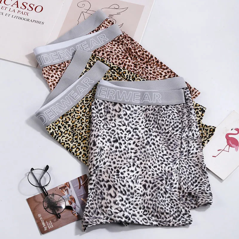 Men's loose leopard print underwear in milk silk polyester fabric showing mid-waist design