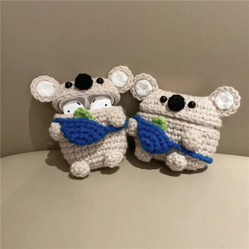Handmade knitted grey koala bear backpack design cover on an Apple AirPods Pro charging case.