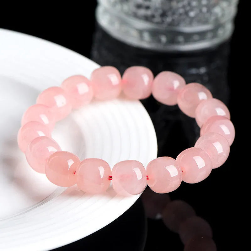Pink crystal barrel bead bracelet with 8-10mm polished geometric beads