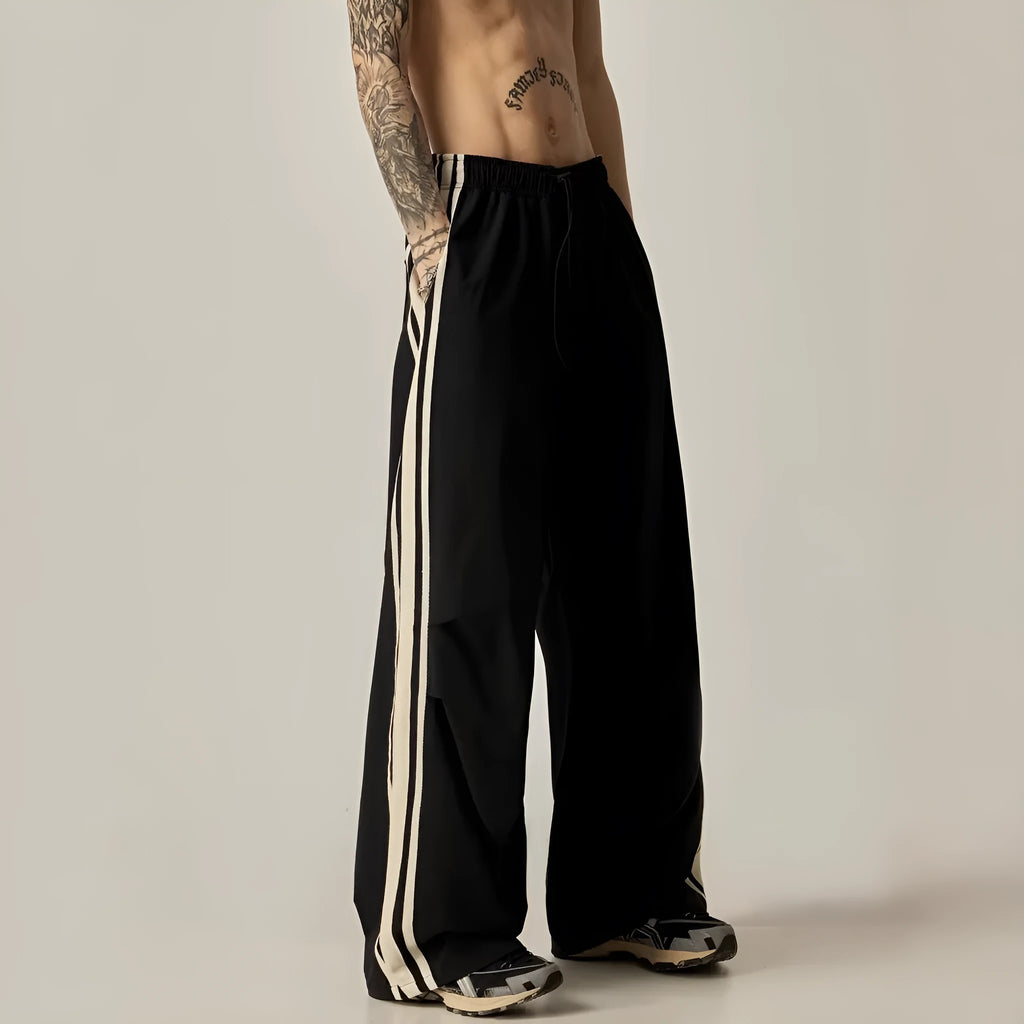 Black high-waisted wide leg straight trousers for men, made from polyester fibre.